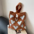 Brown knit tote bag with blue heart pattern, stylish casual shoulder bag for daily commute. - Brown