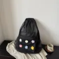 Black mesh drawstring backpack with colorful crochet flowers, lightweight beach and sports bag. - Black
