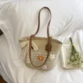 Chic straw woven shoulder bag with floral crochet and lace bow, perfect for beach vacation. - Beige Hollow Out