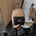 Korean fashion straw woven mini backpack with black quilted pocket, chic chain strap and top handle. - Black