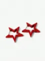 Detailed close-up of red star hoop earrings, geometric hollow alloy design, stylish accessory. - Red Lacquered Style (M230412007-5)