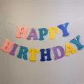 Colorful macaron Happy Birthday letter paper banner garland close up view for party decor. - Pearlescent Macaron Birthday Letter Banner