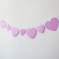 Glitter pink heart paper garland banner for party decoration and celebration events. - 7-Piece Glitter Pink Heart Garland