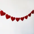 Red heart garland hanging decoration, romantic party supplies, red felt heart banner for events. - Glitter Red Hearts