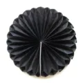Close-up detail of the black paper honeycomb ball decoration, showing neat folds and texture. - Black