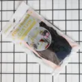 Detailed view of foil fringe curtain packaging, showing laser effect and party decoration. - 2x1m / Black
