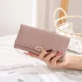 Close-up of a pink quilted leather long wallet for women featuring a gold clasp - Dusty Pink