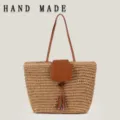 Handmade straw woven shoulder bag for casual beach vacation style, minimalist tote - Camel