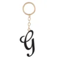 Gold-toned metal keychain featuring a sleek black enamel script letter G pendant detail. - Letter G