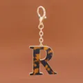 Goldfarbener Legierungs-Schlüsselanhänger mit Schildpatt-Muster Buchstabe R Anhänger. - Buchstabe R