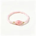 Bracelet en perles roses avec un pendentif en forme de coquillage brillant. - Conque Rose