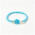 Bracelet bohème fait main en perles bleues avec petit charm poisson rayé détaillé - Poisson Rayé Bleu