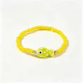 Bracelet de perles jaunes avec un joli pendentif poisson vert - Poisson à Pois Jaunes