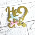 Gold glitter gender reveal cake topper with cute blue and pink bows for party decoration. - "He or She" with Bow