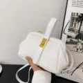 White PU leather kiss-lock top handle shoulder bag with golden clasp for women daily style. - White