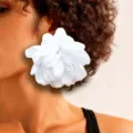 Macro detail of large white fabric flower earring shown worn on model for romantic style - White One Flower