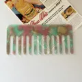 Detailed shot of marbled acetate wide-tooth hair comb, elegant pink and green tones. - 2# Green & Pink