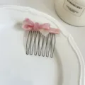 Pink acetate bow hair comb with metal teeth, elegant hair accessory for daily styling. - Pink