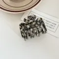 Acetate hair claw clip detail view, tortoiseshell pattern medium shark clip for elegant hairstyles. - Coconut Jelly
