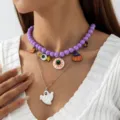 Collier d'Halloween superposé avec perles violettes, pendentifs fantôme et citrouille - Œil Violet (N-007)