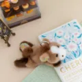 Cute floral plush animal keychain, brown lying doll with metal ring, soft desk companion gift. - Pony