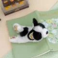 Cute black and white plush animal keychain with floral ears, soft desktop companion doll gift. - Bulldog
