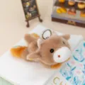 Cute brown plush animal keychain with floral ears and keyring, perfect desk decor gift. - Ox