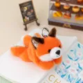 Cute orange plush fox keychain with floral details, soft stuffed animal bag charm for keys or backpack. - Fox