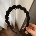 Black twisted hair hoop with inner teeth, fabric wrapped headband for stylish daily hair styling. - Black