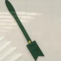 Green PU leather bag charm with custom alphabet design, gold hardware and stylish look. - Green