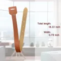 Detail view of adjustable leather curtain tieback strap with snap button and punch-free design. - Tan