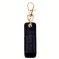 Detalle portalápices de cuero negro, mosquetón portátil, accesorio de oficina compacto. - Negro