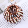 Bruine vogelnest haarspeld met sprankelende strass-steentjes voor elegante knotjes. - Strass Vogelnest Haarspeld / Oranje