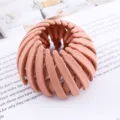 Pink expandable bird nest hair clip detail showing flexible mesh ring structure for ponytails. - Bird's Nest Scrunchie / Pink