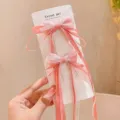 Cute pink mesh bow hair clips with long ribbons detail shot, perfect for children styling accessories. - Pink Long Ribbon Hair Clips - Pack of 2