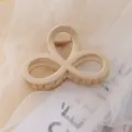 Elegant minimalist beige acrylic hair claw clip, chic daily hair accessory for women styling. - Khaki Figure-8 Hair Clips