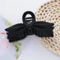 Black matte bow hair claw detail, solid acrylic shark clip for stylish daily hair styling. - Black Bow Claw Clip