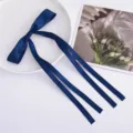 Dark blue satin bow hair clip detail, elegant long ribbon balletcore hair accessory style. - Navy Blue