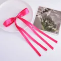 Bright pink satin ribbon bow hair clip with long streamers for sweet chic style detail. - Rose Red
