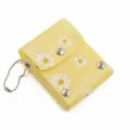 Yellow mini lipstick storage bag with cute daisy pattern, portable snap-button design. - Yellow