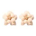 Exquisite floral detail shot showing the delicate camellia petal texture and gold stamen design. - Milky White