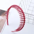 Gedetailleerd aanzicht rode golf tanden plastic haarband gezicht wassen anti-slip accessoire. - Getande Hoofdband / Oranje
