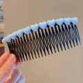 Close-up detail of cute white heart hair comb, black plastic teeth for styling bangs securely. - Large Light Blue Heart Hair Side Comb