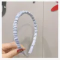 Light blue pleated fabric headband for women, stylish ruffled hair hoop variant. - Light Blue