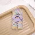 Detailed view of colorful elastic hair ties in a clear storage box with a rainbow wrapper. - Small Flower Hair Ties (Box of 60)