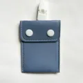 Detailed view of the blue baby pacifier pouch with white clip and snap button design. - Sky Blue