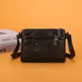 Black washed soft leather crossbody bag with multiple zipper pockets for daily casual use. - Black (Vertical Stripes)