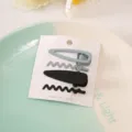 Simple metal hair clips set of four, featuring minimalist wave and straight designs for daily use. - Black 4-Piece Set