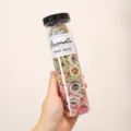 Gedetailleerd overzicht van een doorzichtige cilinder met kleurrijke mini haarelastiekjes. - Pluizige Lijn Stijl / 300 Stuks/Verpakking / Ijskleuren