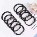 Detailed view of black elastic hair ties, showing high elasticity and durable metal connectors. - Coffee